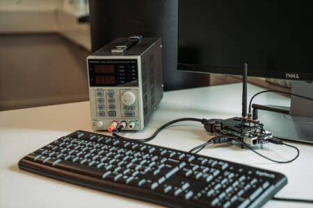 Raspberry Pi single-board computer connected to a keyboard and monitor on a desk