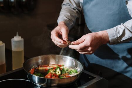 Set Up Mealie for Self-Hosted Recipe Management and Meal Planning A tidy home kitchen with fresh ingredients laid out on the counter, representing organized home cooking and meal planning