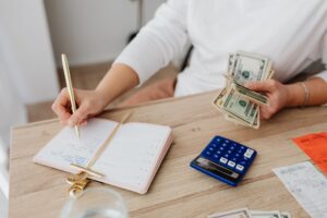 Set Up Actual Budget for Local-First Personal Finance Tracking Open notebook and pen on a desk used for personal budget planning