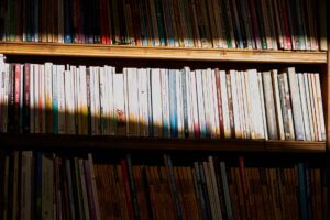Set Up Kavita as a Self-Hosted Comic and Manga Server A shelf of organized comic books representing a personal comic library collection