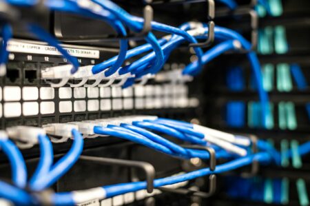 A compact home server setup with networking equipment and a small form-factor PC