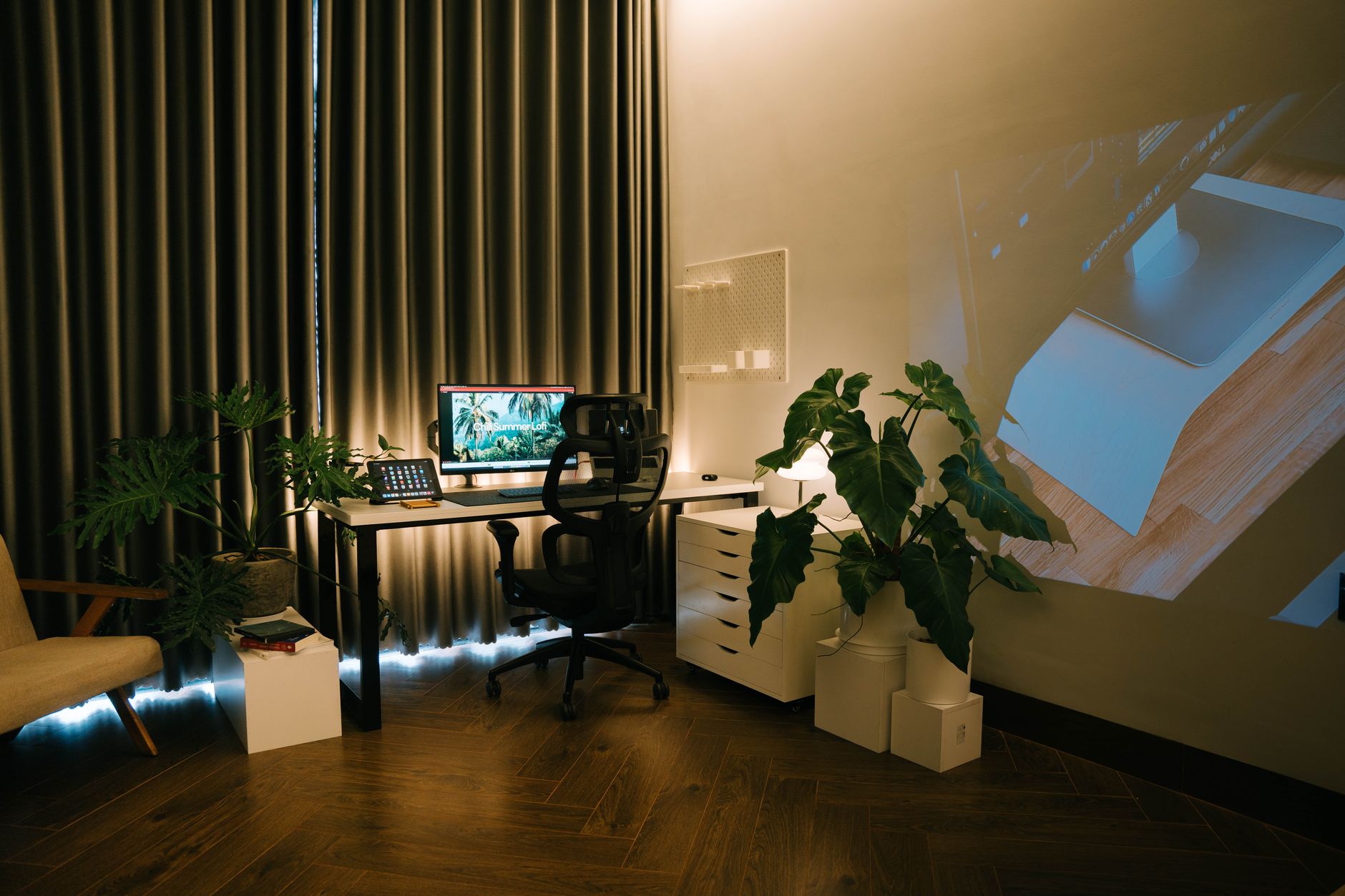 Home office desk with laptop and monitor showing remote network access setup
