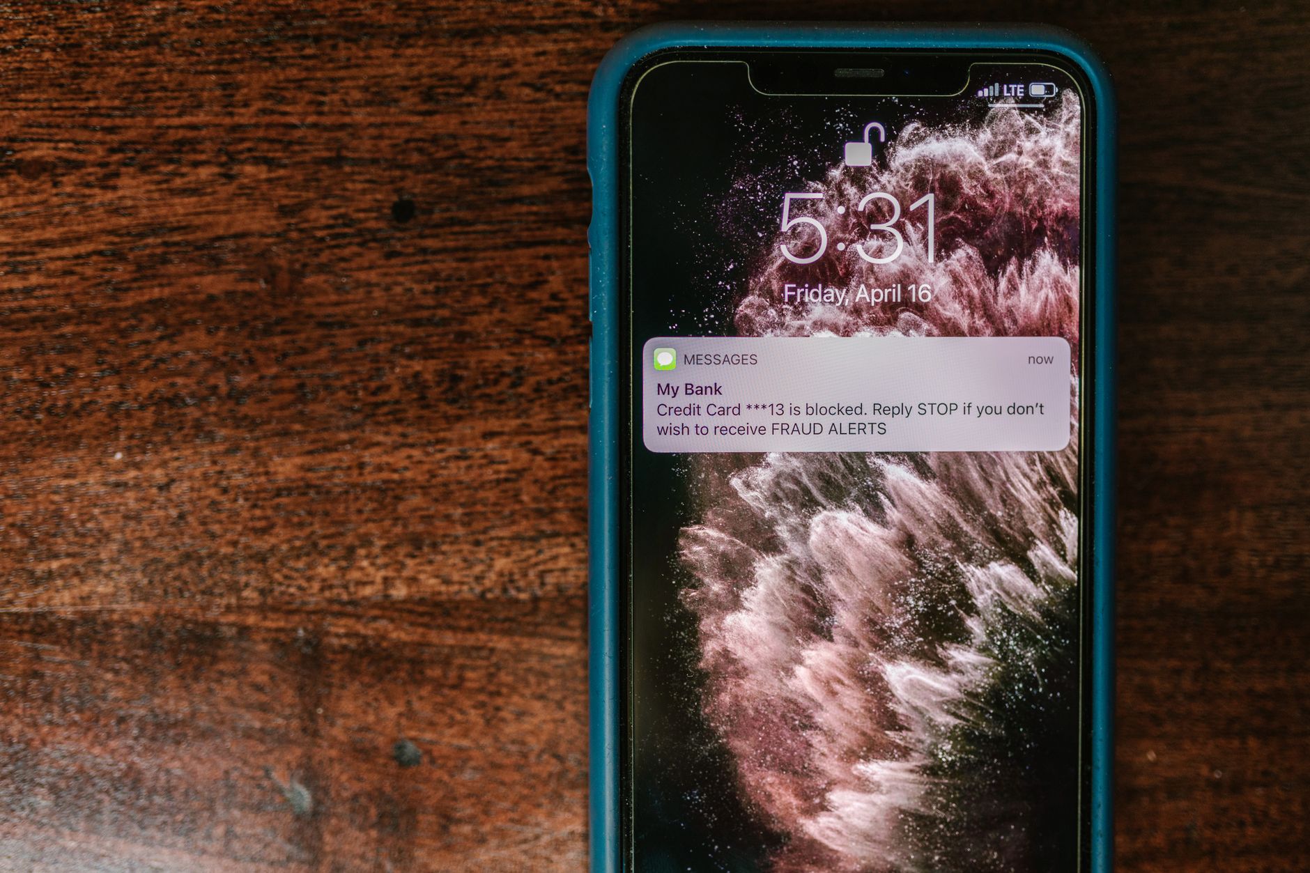 A smartphone displaying a push notification alert from a web monitoring service