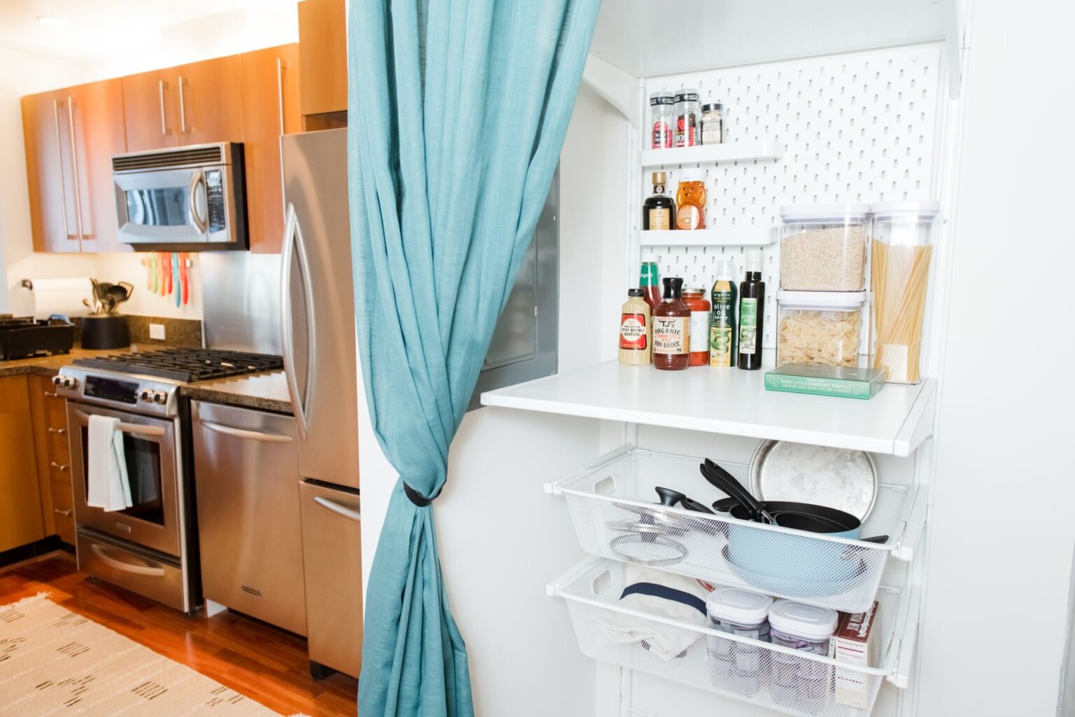 Set Up Grocy for Self-Hosted Household and Grocery Management Organized kitchen pantry with labeled shelves and stocked food items