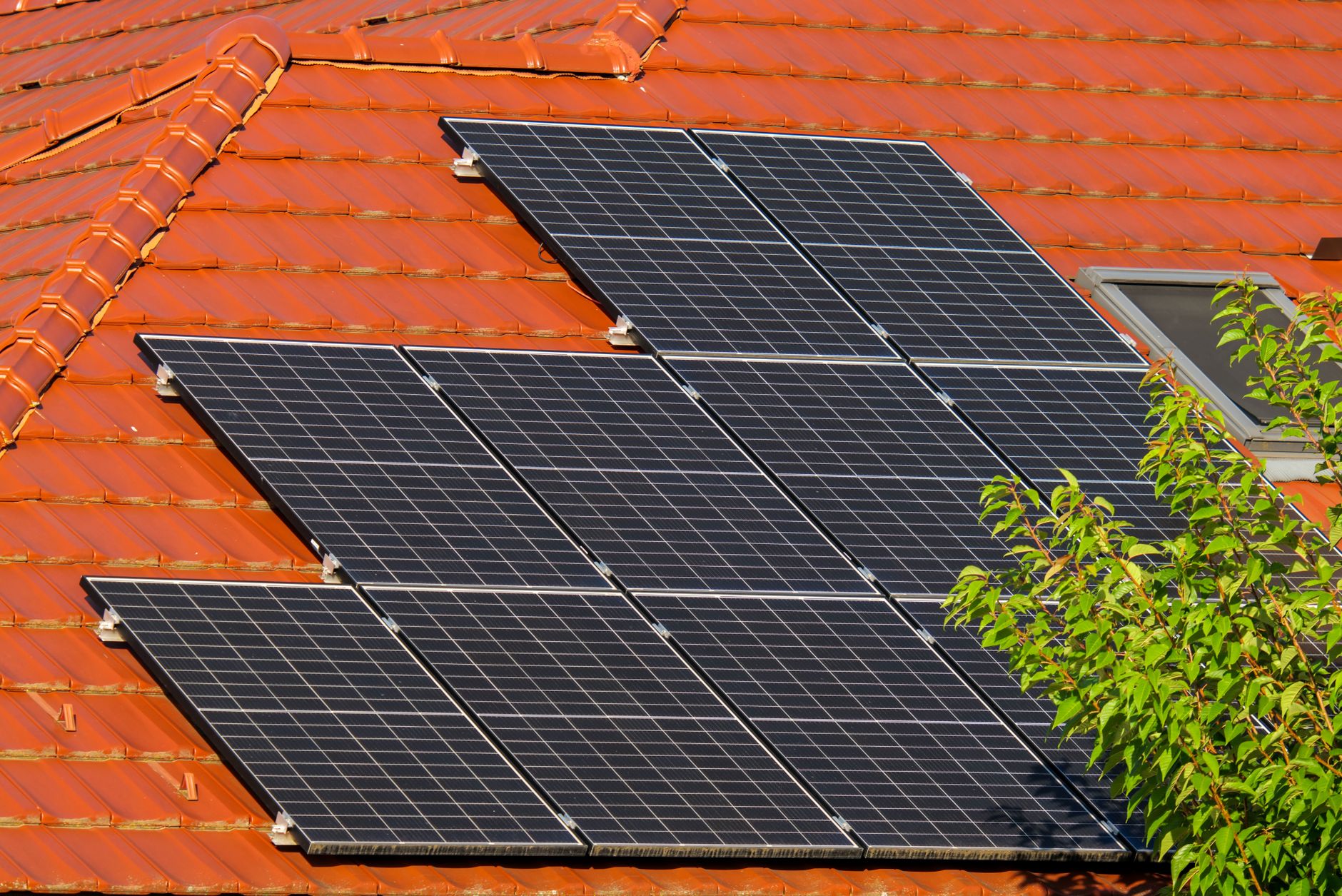 Solar panels set up outdoors connected to a portable power station for off-grid charging