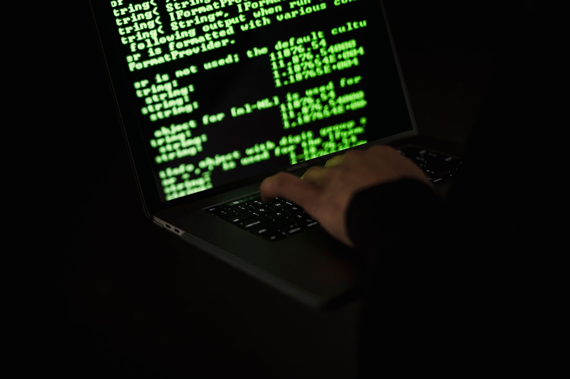 Laptop showing a terminal or command line interface for server configuration