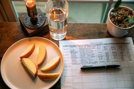 Organized kitchen counter with meal planning notes and fresh ingredients