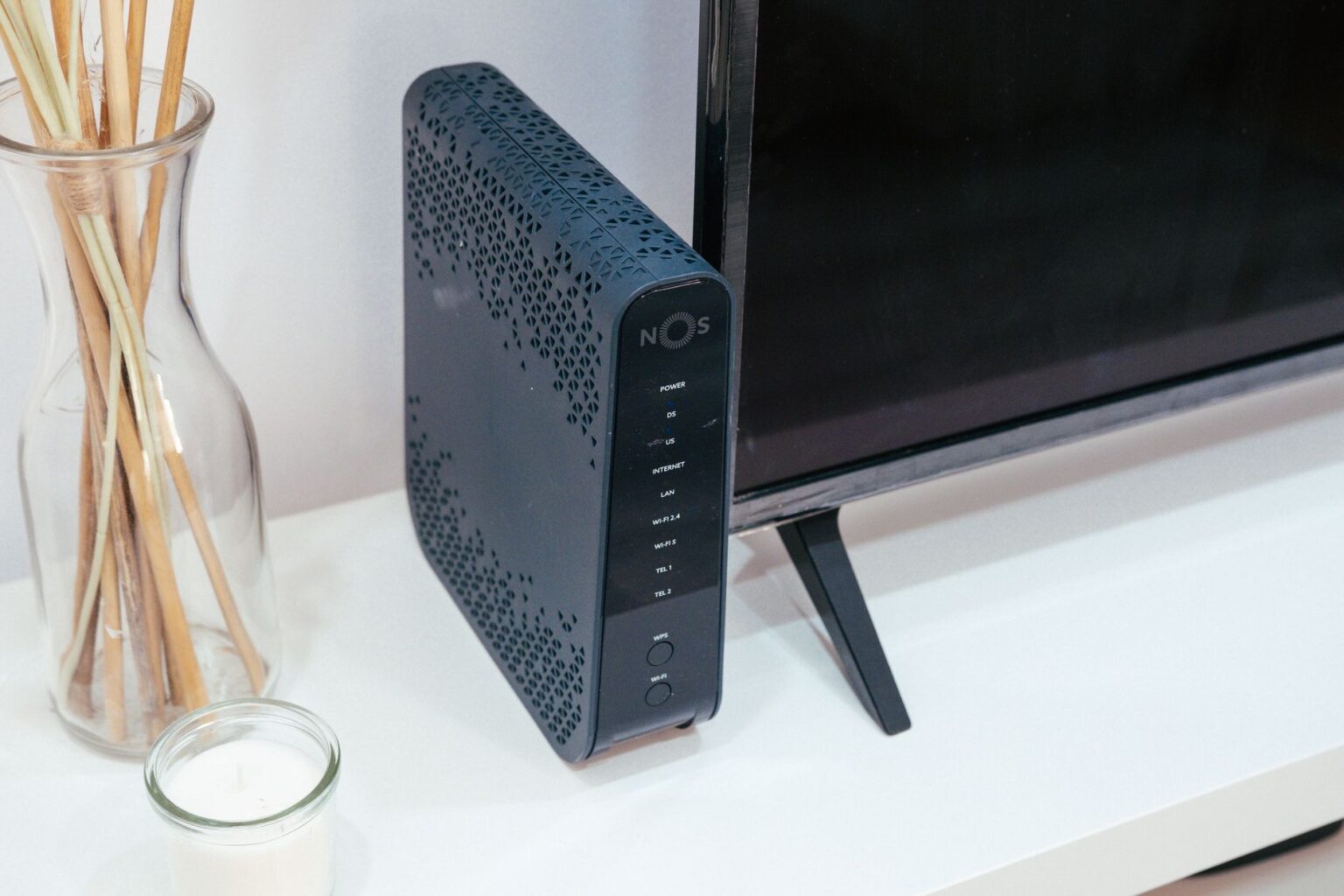 A smart home hub device sitting on a desk representing home automation setup