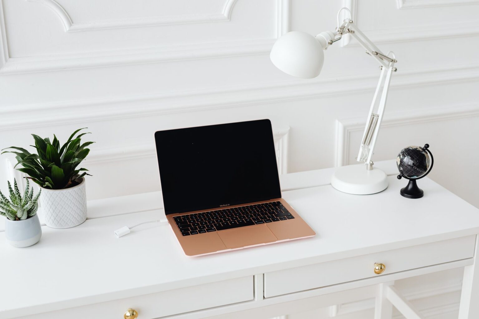 A tidy home office desk setup representing personal finance management at home