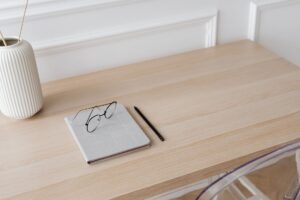 A clean home office desk setup representing a personal document management workspace