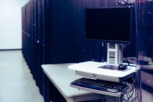A home media server setup with a desktop computer and external hard drives on a desk