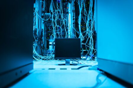 Rows of servers in a data center representing self-hosted infrastructure
