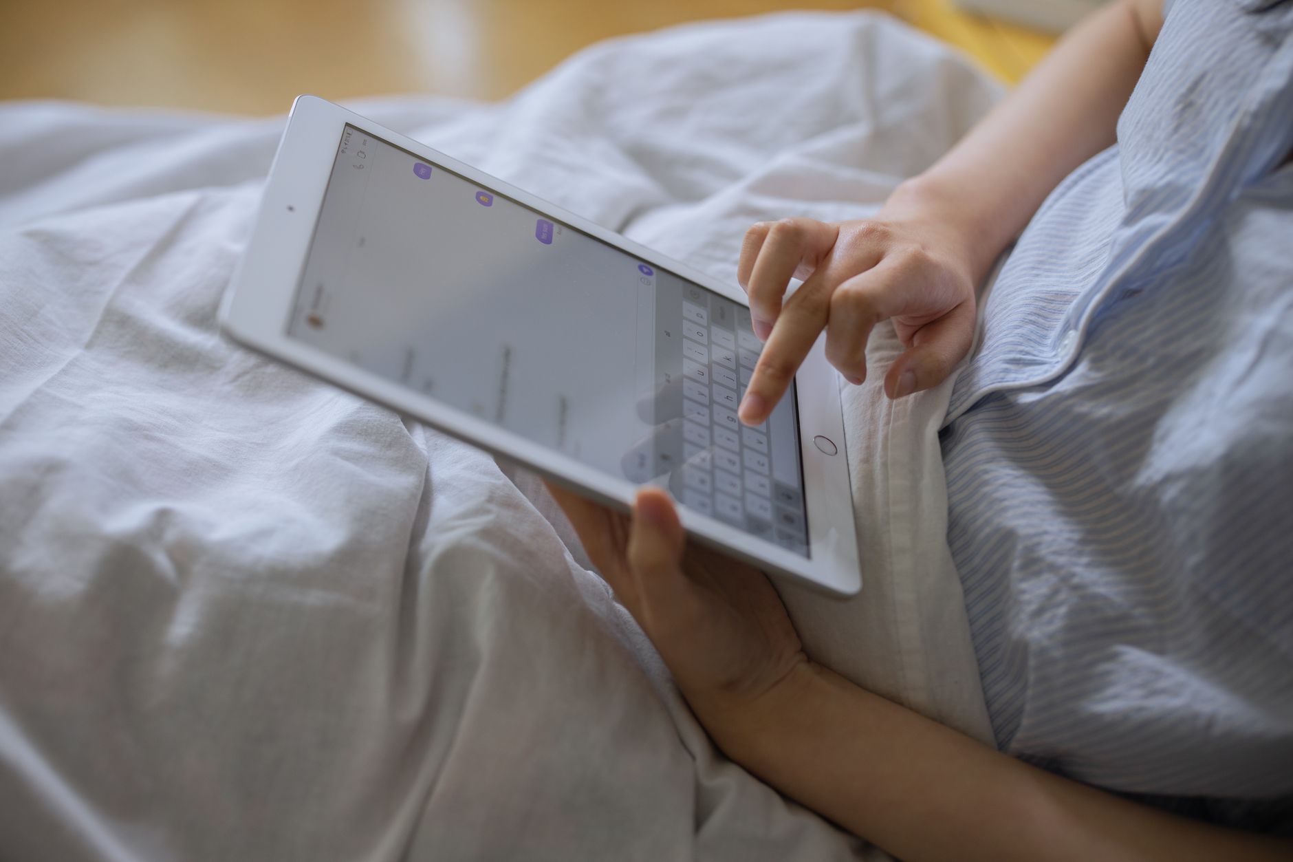 Person reading content on a tablet or mobile device