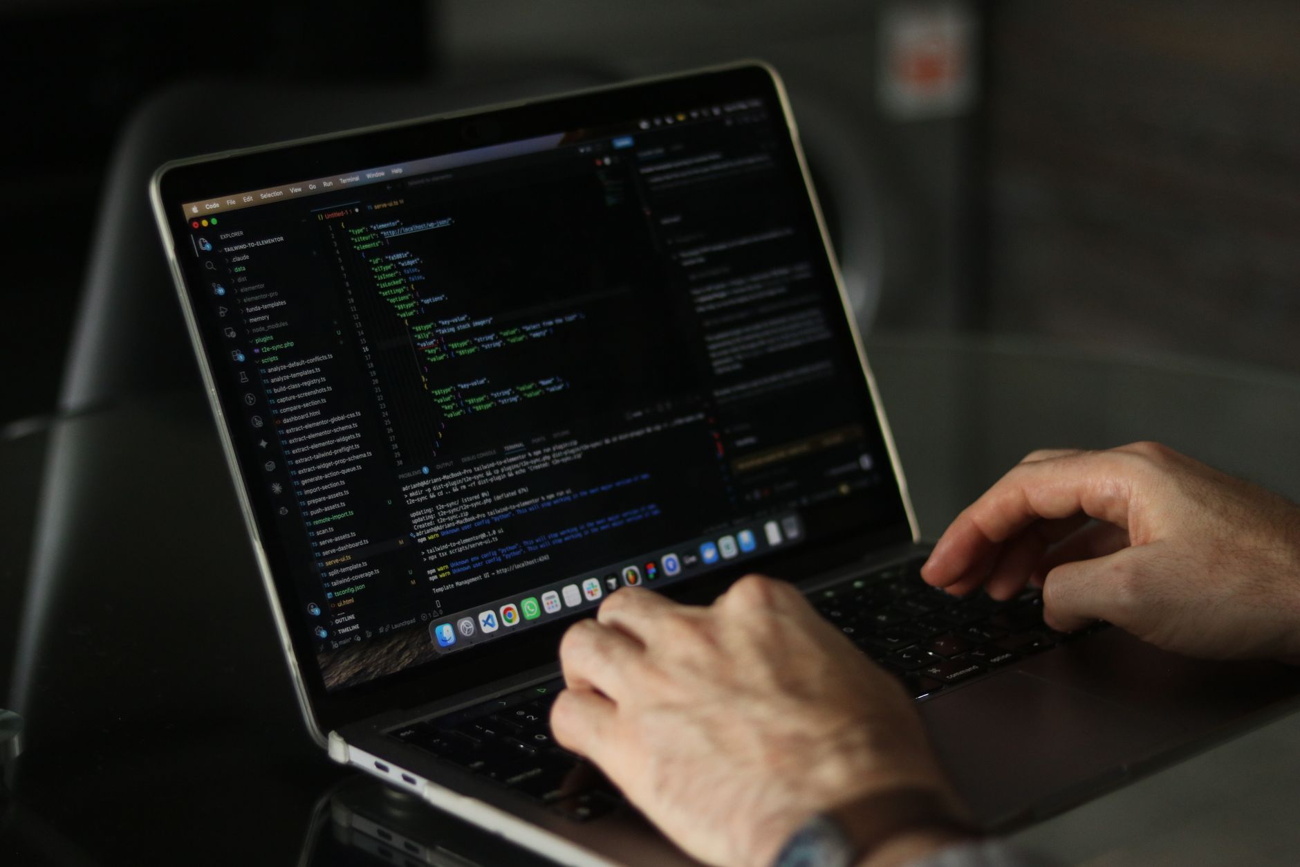 Laptop screen displaying code in a development environment